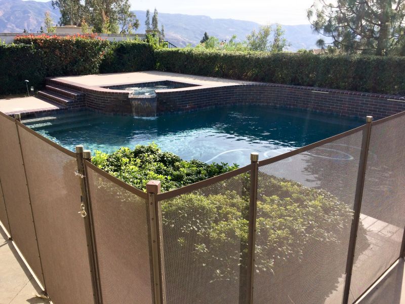 Mesh Fence Securing a Pool